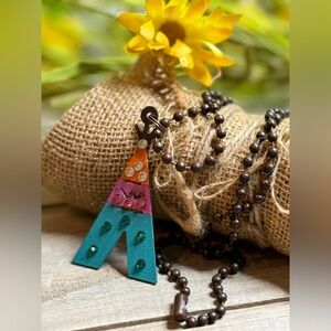 Colorful and whimsical teepee necklace with crystals on 34” antique bronze chain